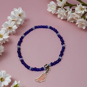 Cobalt Blue Beaded Bracelet with Pink Wing Charm